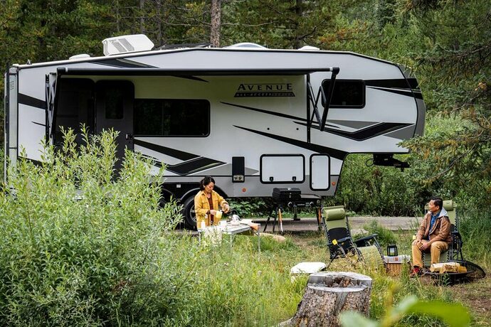 Alliance Avenue fifth wheel under 30 feet in wooded campground