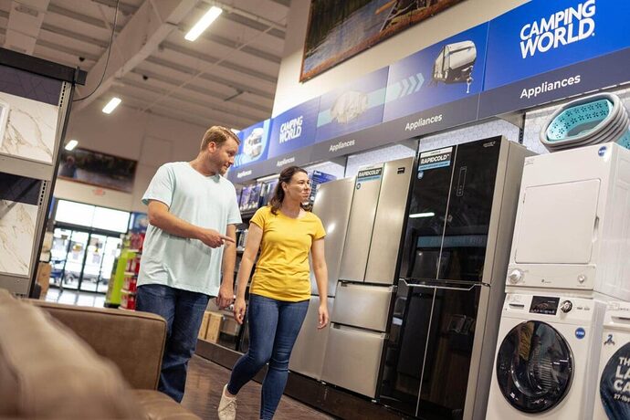 Couple shopping inside Camping World retail store