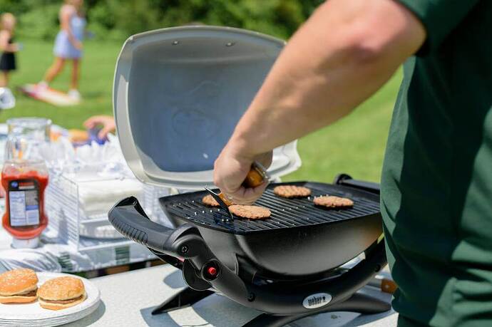 Burgers cooking on outdoor grill