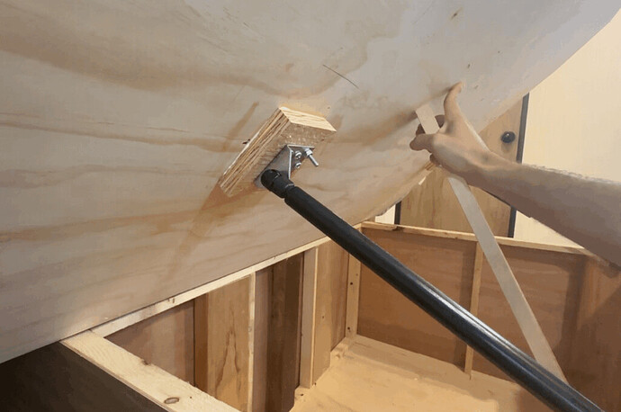 Connecting struts to finish installing lift cylinders under camper bed