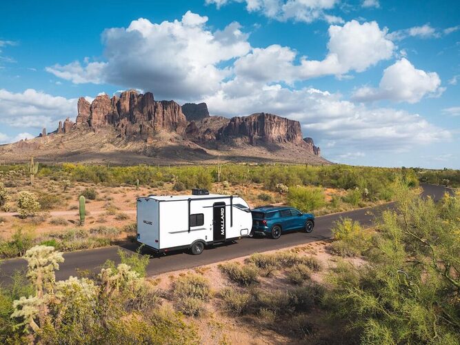 mallard RV being towed in the desert