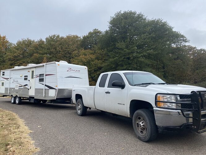 Our second travel trailer hitched up to our truck.