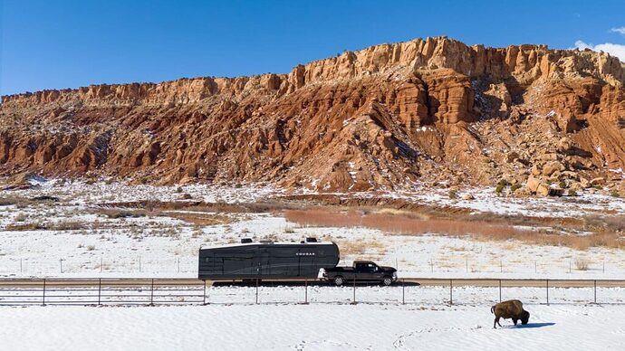 Truck towing large Cougar fifth wheel