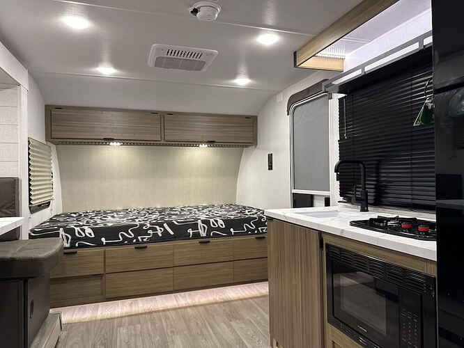 Image of the interior of the Salem FSX 178ICE featuring the bed and part of the kitchen to the right.