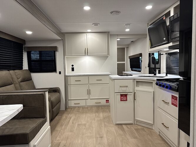 2026_grand_design_transcend_335bht kitchen and living area