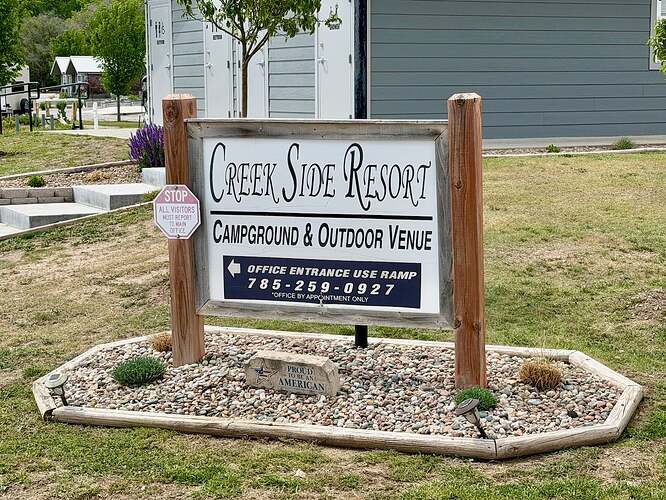 Creek side resort sign