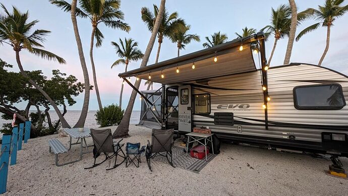 2020 Forest River EVO toy hauler in a beach campground