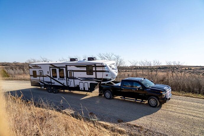 Truck towing Fuel fifth wheel toy hauler