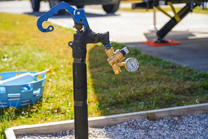 Campground spigot with RV water pressure regulator installed
