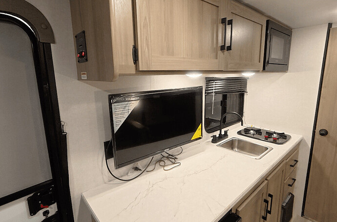 Installed 32-Inch TV in Coleman off-grid camper