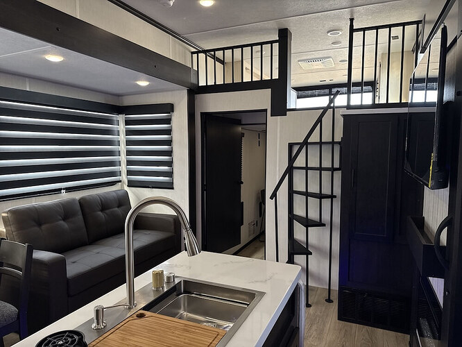 Image of living area featuring kitchen island and couch from the Vengeance Rogue Store 297STORE.