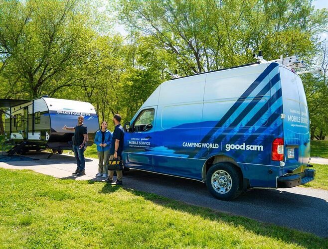 Technician explaining mobile rv repair costs to RV owners
