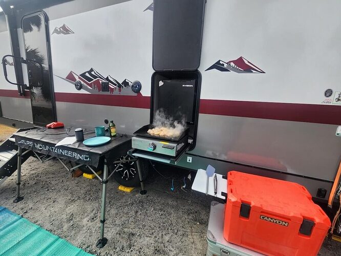 outdoor kitchen of campsite ultra travel trailer