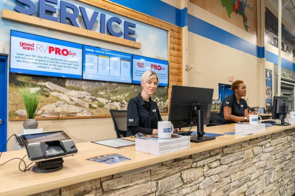 Camping World service center desk with female service advisors behind the counter