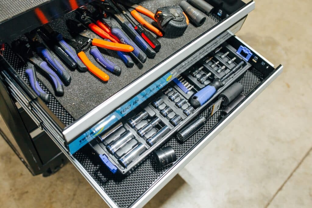 Tools in their respective tool box drawers.