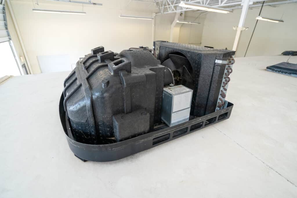 Overhead rooftop A/C unit without shroud