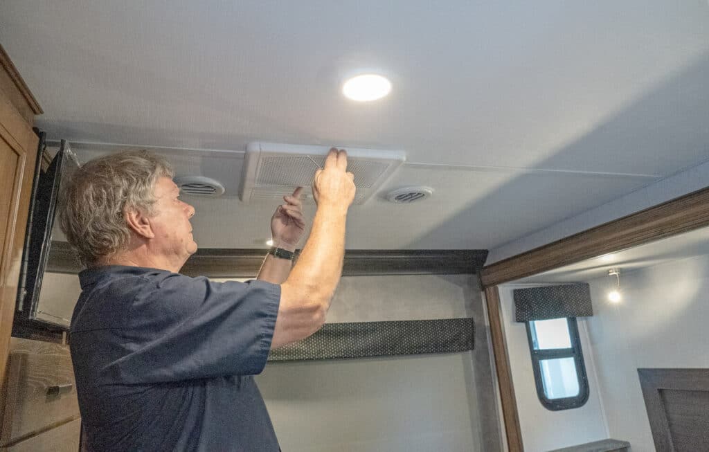 Technician servicing RV AC